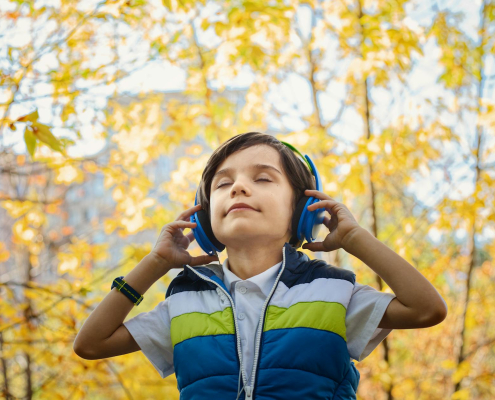 photo of a boy listening in headphones
