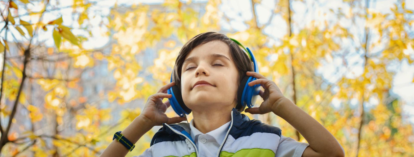 photo of a boy listening in headphones